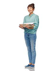 Image showing smiling young asian woman sorting paper waste