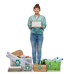 Image showing smiling asian woman with tablet pc sorting waste