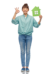 Image showing asian woman with green house showing ok hand sign