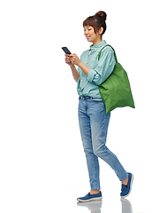 Image showing woman with phone and reusable food shopping bag