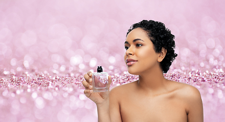 Image showing young african american woman with perfume