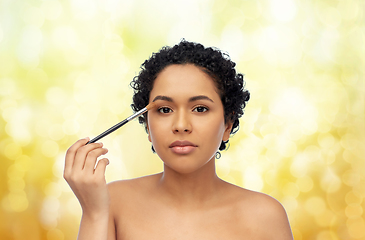 Image showing african american woman with make up brush