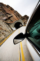 Image showing car approacting tunnel through mountains