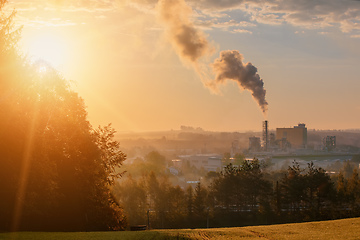 Image showing industrial cityscape with with smoking factory