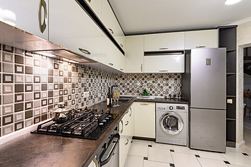 Image showing Brown and white modern kitchen interior