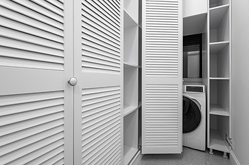 Image showing White laundry room inside wardobe in new apartment