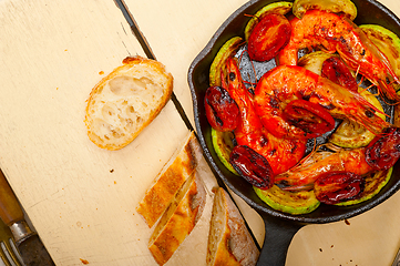 Image showing roasted shrimps with zucchini and tomatoes