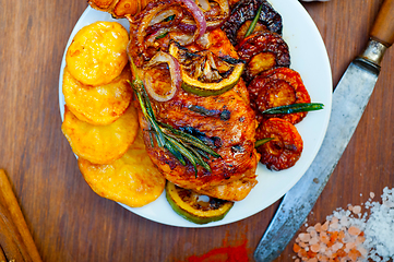 Image showing roasted grilled BBQ chicken breast with herbs and spices