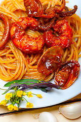 Image showing Italian seafood spaghetti pasta on red tomato sauce