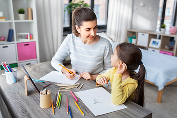 Image showing mother with little daughter drawing at home