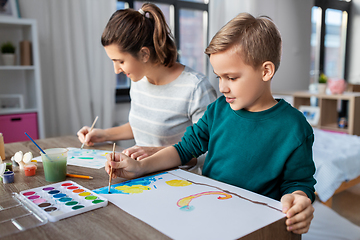 Image showing mother and son with colors drawing at home