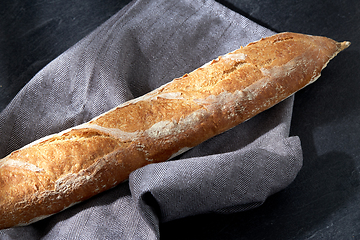 Image showing close up of baguette bread on kitchen towel