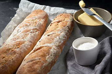 Image showing close up of bread, butter and knife on towel