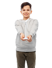 Image showing smiling boy with toy wind turbine