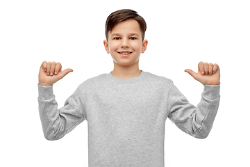 Image showing happy smiling boy pointing fingers at himself