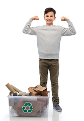 Image showing smiling boy sorting paper waste