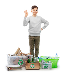 Image showing smiling boy sorting paper, metal and plastic waste