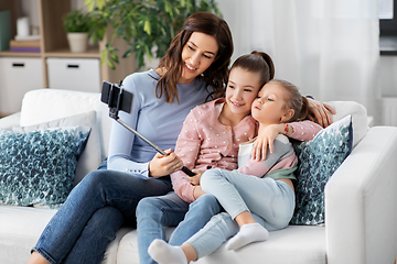 Image showing happy family taking selfie by smartphone at home