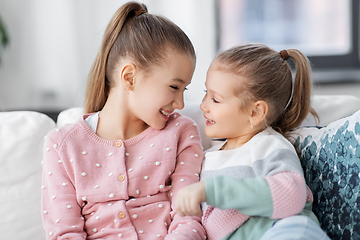 Image showing two happy smiling little girls or sisters at home