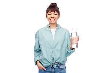 Image showing happy asian woman holding glass bottle with water