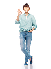 Image showing happy asian woman over white background
