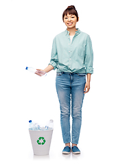 Image showing smiling young woman sorting plastic waste