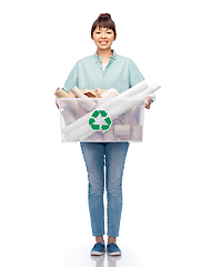 Image showing happy smiling asian woman sorting paper waste