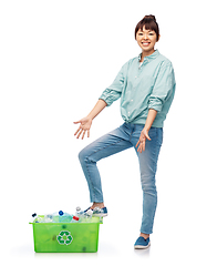 Image showing smiling young asian woman sorting plastic waste