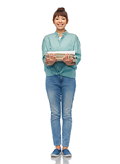 Image showing smiling young asian woman sorting paper waste