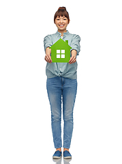 Image showing smiling asian woman holding green house