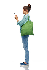 Image showing woman with phone and reusable food shopping bag