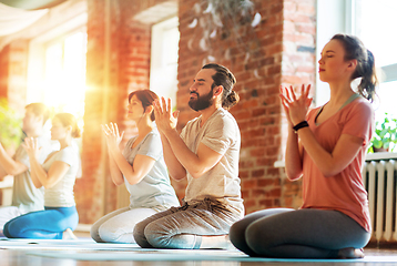 Image showing group of people meditating at yoga studio