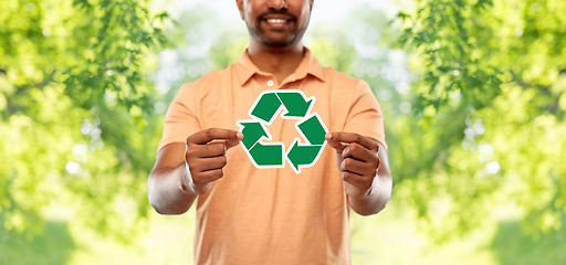 Image showing smiling indian man holding green recycling sign