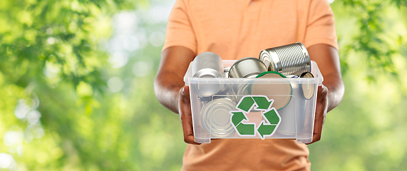 Image showing close up of young man sorting metallic waste