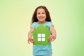 Image showing smiling little girl holding green house icon