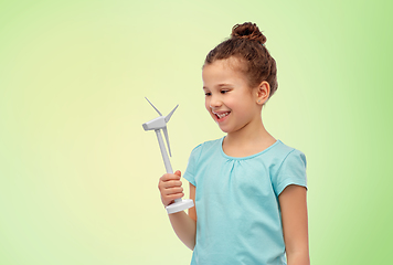 Image showing smiling girl with toy wind turbine