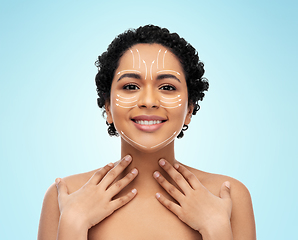 Image showing young african american woman with arrows on face