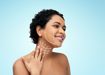 Image showing young african american woman with arrows on face