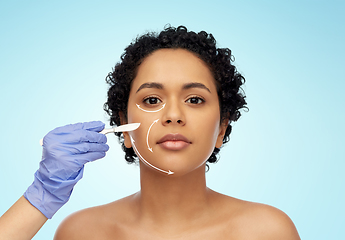 Image showing african american woman and hand with scalpel knife