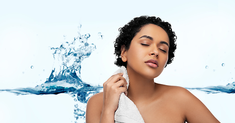 Image showing young african american woman with bath towel