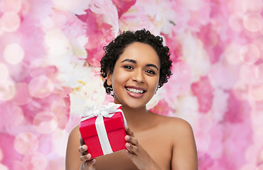 Image showing portrait of young african american woman with gift