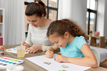 Image showing happy mother with little daughter drawing at home