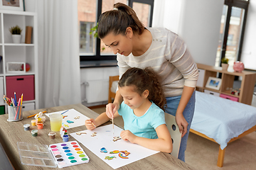 Image showing mother with little daughter drawing at home