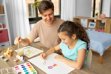 Image showing happy father with little daughter drawing at home