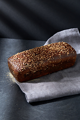 Image showing homemade craft bread with seeds on table