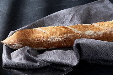 Image showing close up of baguette bread on kitchen towel