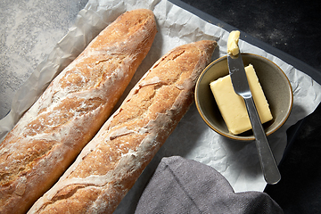 Image showing close up of bread, butter and knife on towel