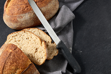 Image showing homemade craft bread with kitchen knife