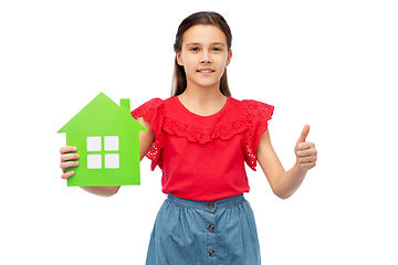 Image showing happy girl with green house icon showing thumbs up