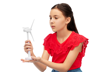 Image showing smiling girl with toy wind turbine